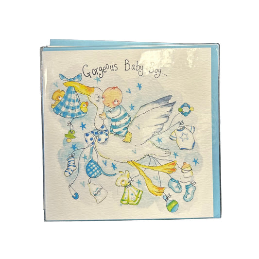 Baby shower card with stork and baby elements on a textured surface