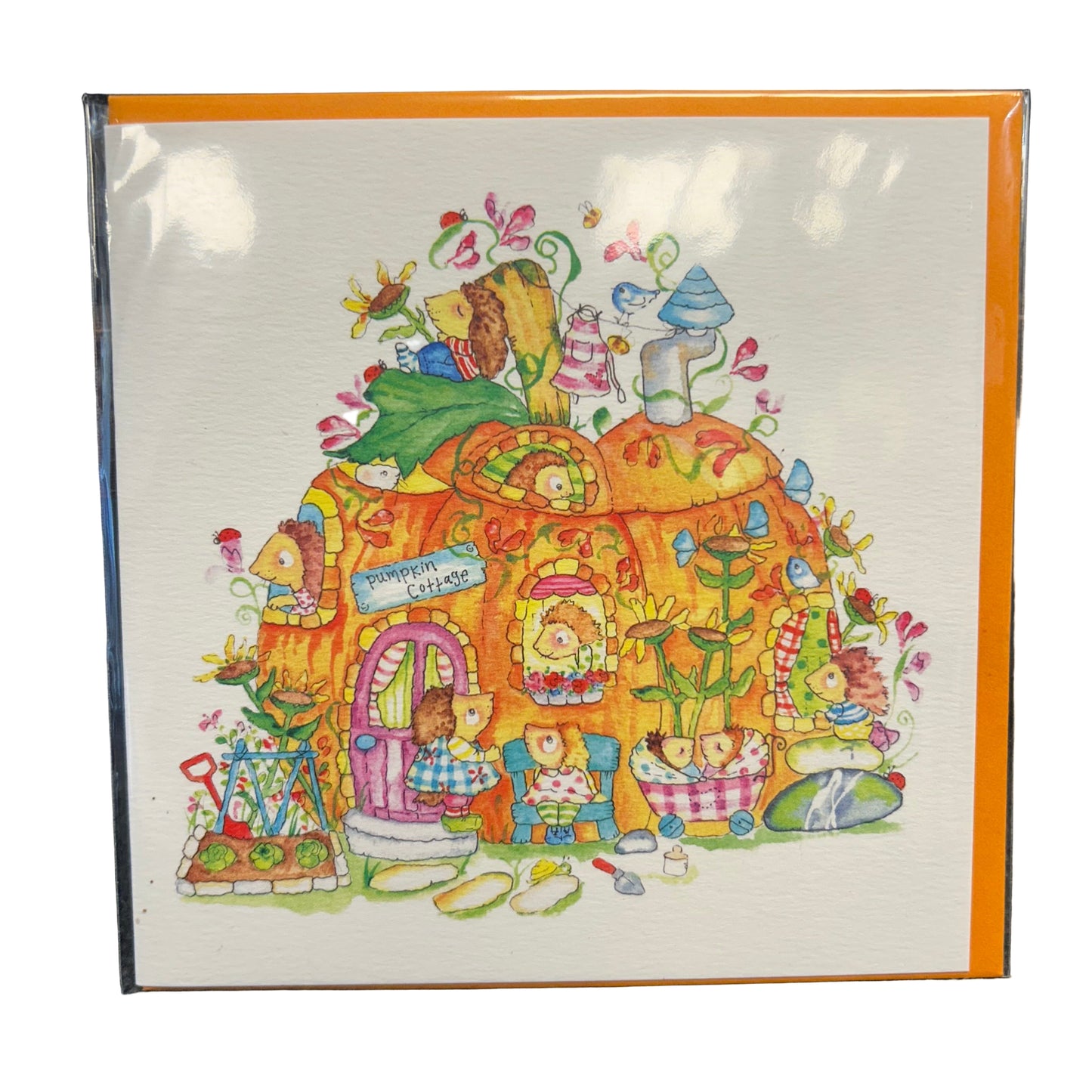 Colorful illustration of a cartoon house with characters on a white card with orange border.