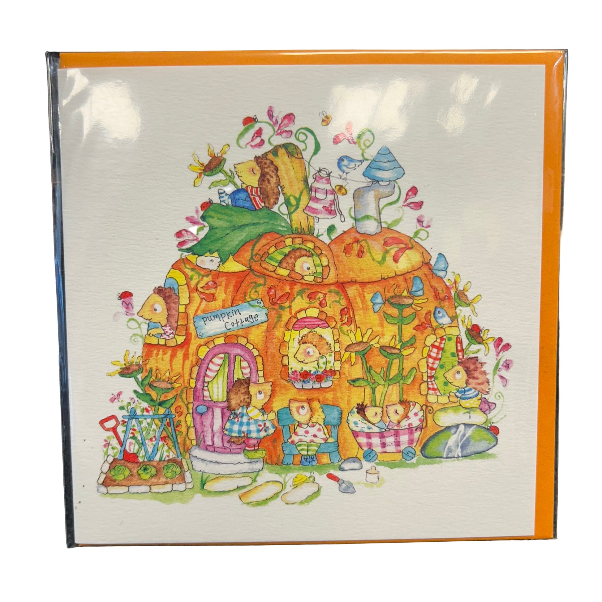 Colorful illustration of a cartoon house with characters on a white card with orange border.