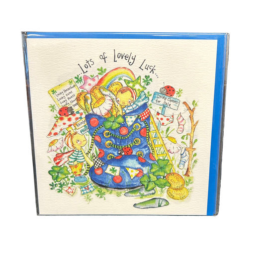 Greeting card with colorful illustration of a boot filled with lucky charms and text 'Lots of Lovely Luck' on a textured surface.