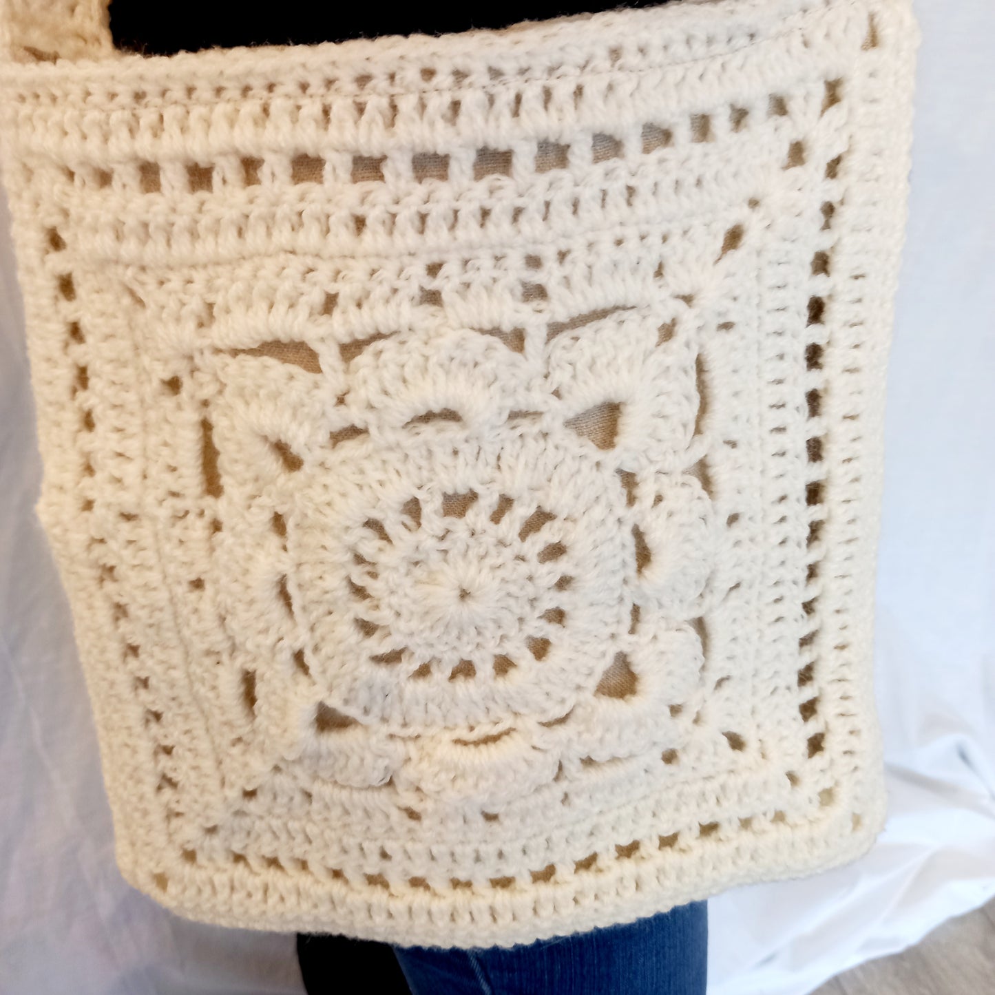 "Hand made crochet bag with flower details"