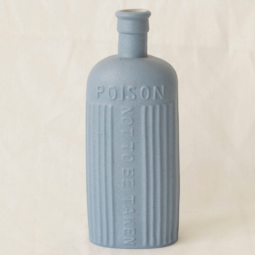 "Porcelain Cast Poison Bottle"